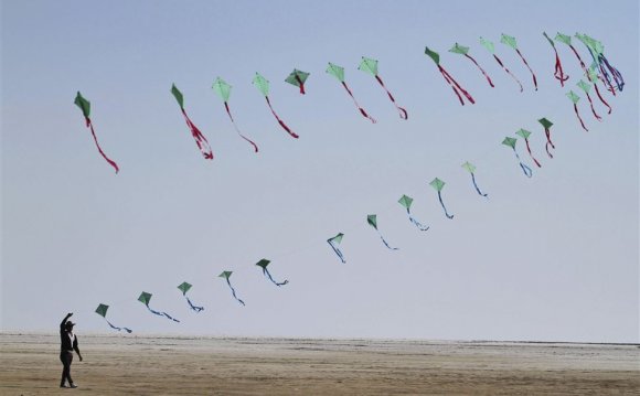 An Indian participant flies a