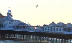 Brave kitesurfer Lewis Crathern soars over the Brighton Pier