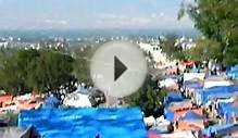 Children flying kites in tent camp in Haiti.avi