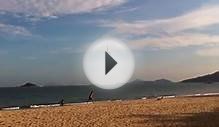 People flying kites at Cheng Sha Beach, Hong Kong